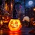 Halloween boszorkánykalapos világító és kacagó töklámpás tartónyéllel